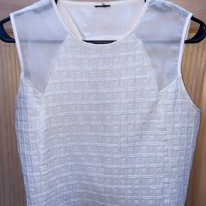 Sleeveless crop top. Fits right above the waist.